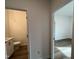 Hallway with open doorways into a bathroom and bedroom at 4310 Emeline Way # 18, Fuquay Varina, NC 27526