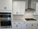Close-up of a modern kitchen with stainless steel appliances, gas cooktop, and white subway tile backsplash at 4310 Emeline Way # 18, Fuquay Varina, NC 27526