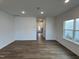 Bright living room with hardwood floors and a large window at 4310 Emeline Way # 18, Fuquay Varina, NC 27526