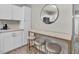 Kitchen breakfast bar features white marble countertop and three barstool chairs at 4408 Poplar Dr, Raleigh, NC 27610