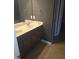This bathroom features a double vanity with granite counters at 5016 Gailardia Dr, Zebulon, NC 27597