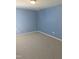 This is a carpeted bedroom featuring painted blue walls at 5016 Gailardia Dr, Zebulon, NC 27597