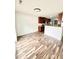 Open-concept kitchen and dining area features hardwood floors, wood cabinets, and stainless appliances at 5016 Gailardia Dr, Zebulon, NC 27597