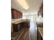 Well-equipped kitchen with stainless steel appliances, wood cabinets and opens to the dining area at 5016 Gailardia Dr, Zebulon, NC 27597