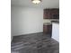 Bright eat-in kitchen area with dark wood cabinets and modern appliances at 5016 Gailardia Dr, Zebulon, NC 27597