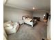 Cozy bedroom with comfortable seating, carpet, and a dresser at 5045 Kota St, Raleigh, NC 27610
