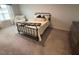 Comfortable bedroom with neutral decor, natural light, and carpet at 5045 Kota St, Raleigh, NC 27610