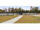 Designated dog park area with secure fencing, grassy areas, and amenities for pet owners and their furry friends at 5045 Kota St, Raleigh, NC 27610