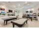 Fun game room featuring a pool table, ping pong, foosball, and various arcade games for entertainment and leisure at 5045 Kota St, Raleigh, NC 27610