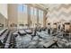 Well-equipped gym with treadmills, elliptical machines, weights, and large windows offering natural light during workouts at 5045 Kota St, Raleigh, NC 27610
