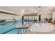 Spacious indoor pool area with ample natural light and a separate shallow area, perfect for year-round enjoyment at 5045 Kota St, Raleigh, NC 27610
