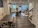 Open floor plan with a modern kitchen, dining space, and cozy living room area at 5045 Kota St, Raleigh, NC 27610