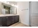Modern bathroom with a double vanity, tile flooring, and a walk-in shower at 5347 Cypress Ln, Raleigh, NC 27609