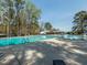 Large community pool with several swimming lanes on a sunny day at 5347 Cypress Ln, Raleigh, NC 27609
