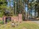 Welcoming brick community sign amid colorful flowerbeds, indicating a well-maintained neighborhood entrance at 5347 Cypress Ln, Raleigh, NC 27609