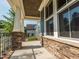 Inviting front porch with stone accents and decorative columns at 5347 Cypress Ln, Raleigh, NC 27609