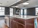 Open kitchen featuring granite counters, stainless steel appliances, and a large island with eat-in seating at 5347 Cypress Ln, Raleigh, NC 27609