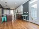 Modern kitchen with an island, stainless steel appliances, and hardwood floors, with access to the outdoors at 5347 Cypress Ln, Raleigh, NC 27609