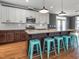 Modern kitchen features a large island, granite countertops, and ample cabinet space at 5347 Cypress Ln, Raleigh, NC 27609