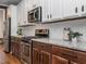 Charming kitchen with granite countertops, subway tile backsplash and stainless appliances at 5347 Cypress Ln, Raleigh, NC 27609