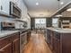 Open kitchen with stainless steel appliances transitions into the dining area at 5347 Cypress Ln, Raleigh, NC 27609