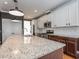 Spacious kitchen features granite counters, stainless steel appliances and ample cabinet space at 5347 Cypress Ln, Raleigh, NC 27609