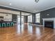 Open-concept living space connecting the kitchen to the living room with hardwood floors and neutral walls at 5347 Cypress Ln, Raleigh, NC 27609