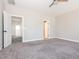 Spacious main bedroom with carpet flooring, ceiling fan, and multiple doorways at 5347 Cypress Ln, Raleigh, NC 27609
