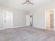 Bright main bedroom featuring neutral colors, carpet flooring, and a ceiling fan at 5347 Cypress Ln, Raleigh, NC 27609