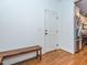 Mud room with hardwood floors, bench seating, and interior access to the garage at 5347 Cypress Ln, Raleigh, NC 27609