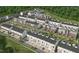 Community aerial view showcasing townhouse-style homes, lush landscaping, and convenient parking in a neighborhood setting at 600 Hedrick Ridge Road # 112, Cary, NC 27519