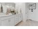 Bathroom featuring double sink vanity with white cabinets, quartz countertop, and brushed nickel hardware at 600 Hedrick Ridge Road # 112, Cary, NC 27519