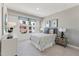 Bedroom with a decorative color palette, area rug, and bedside tables with lamps at 600 Hedrick Ridge Road # 112, Cary, NC 27519