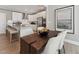 Open dining space with a modern table setup, adjacent to a well-equipped kitchen with stainless appliances at 600 Hedrick Ridge Road # 112, Cary, NC 27519