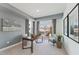 Well-lit office space with a modern desk, comfortable seating, and a glass door to an outdoor balcony at 600 Hedrick Ridge Road # 112, Cary, NC 27519