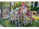 Vibrant community playground showcasing a Cardinal-themed structure with a slide in a green park setting at 600 Hedrick Ridge Road # 112, Cary, NC 27519