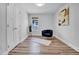 Minimalist bedroom featuring light wood flooring, neutral walls, and modern chair at 602 Gray Ave, Durham, NC 27701