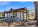 Side view of renovated home featuring covered porch, gray trim and landscaped yard at 602 Gray Ave, Durham, NC 27701