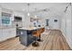 Open-concept kitchen flowing into the living room, with a stylish island and modern appliances at 602 Gray Ave, Durham, NC 27701