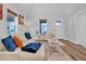 Cozy living room with an off-white couch, wood-look flooring, and neutral decor, creating a welcoming atmosphere at 602 Gray Ave, Durham, NC 27701