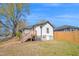 Backyard view of renovated home featuring new wooden deck and stairs at 602 Gray Ave, Durham, NC 27701