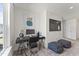Bright home office with a large TV, modern desk, and decorative furnishings at 6529 Winter Spring Dr, Wake Forest, NC 27587