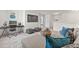 Spacious and inviting living room featuring comfortable seating, a large TV, and a modern work station at 6529 Winter Spring Dr, Wake Forest, NC 27587