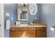 Bathroom featuring a granite countertop and an oval window at 6750 Olde Province Ct, Raleigh, NC 27609