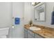 Bathroom with granite countertop and a white sink at 6750 Olde Province Ct, Raleigh, NC 27609