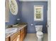 Bathroom featuring a vanity with granite counters, and natural light at 6750 Olde Province Ct, Raleigh, NC 27609