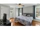 Bedroom featuring hardwood floors, natural light, and a ceiling fan at 6750 Olde Province Ct, Raleigh, NC 27609