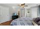 Bedroom featuring hardwood floors, a ceiling fan, and bright light at 6750 Olde Province Ct, Raleigh, NC 27609