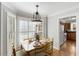 Charming dining area with natural light and direct access to the kitchen for seamless entertaining at 6750 Olde Province Ct, Raleigh, NC 27609
