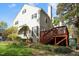 Well-maintained house with lush lawn, a rear deck for outdoor enjoyment, and mature trees offer shade at 6750 Olde Province Ct, Raleigh, NC 27609